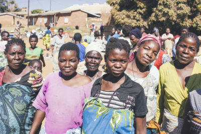 Patients and caregivers living outside of Kasungu District Hospital, Malawi, which was built in the 1970s to accommodate 20,000 people. Today, the hospital serves a population of about 850,000. In order to be near the hospital when they go into labor, women travel to the clinic and live in the courtyard for months before giving birth. Patients and caregivers living outside of Kasungu District Hospital, Malawi, which was built in the 1970s to accommodate 20,000 people. Today, the hospital serves a population of about 850,000. In order to be near the hospital when they go into labor, women travel to the clinic and live in the courtyard for months before giving birth.