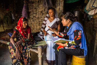 Sarojni Devi (center), who works as an accredited social health activist (ASHA) and Hameeda Kaushar, a Pathfinder counselor (right), visit a client in Bhadawal village, rural Kanpur, Uttar Pradesh, India. Sarojni Devi (center), who works as an accredited social health activist (ASHA) and Hameeda Kaushar, a Pathfinder counselor (right), visit a client in Bhadawal village, rural Kanpur, Uttar Pradesh, India.